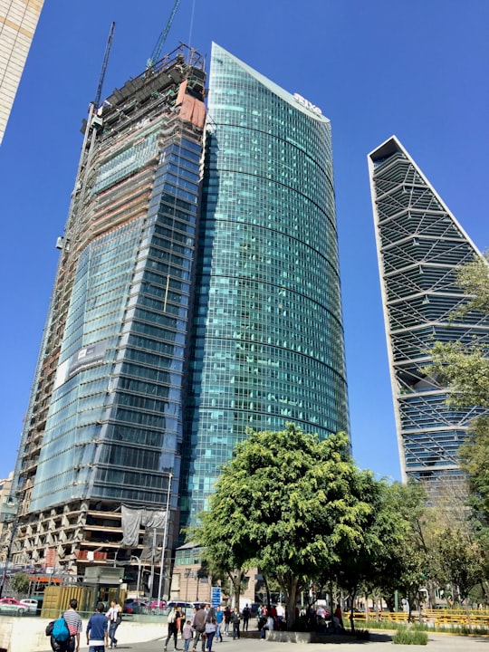blue glass walled high rise building in Lions A1 Access Mexico