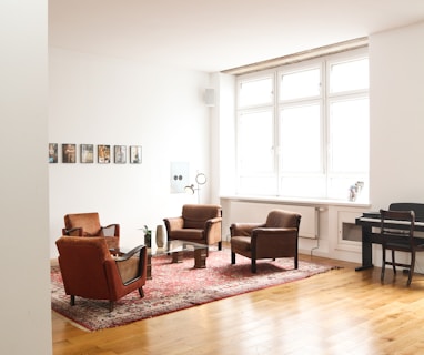 living room with brown wooden parquet floor and white wall