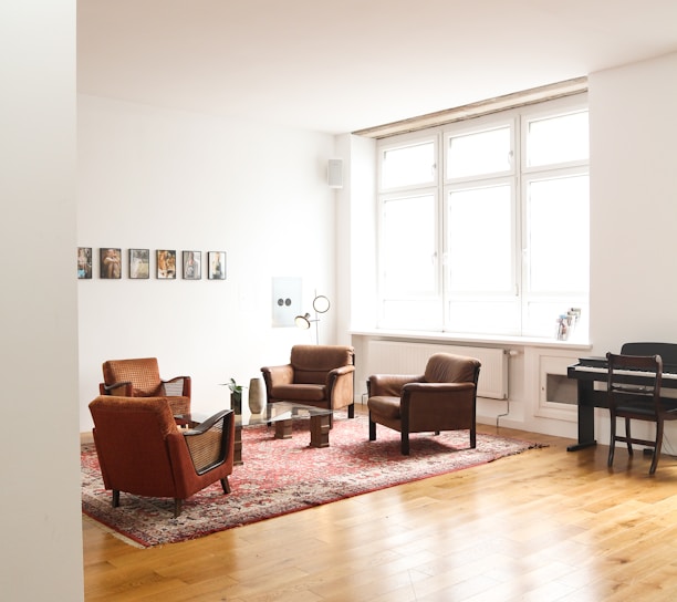 living room with brown wooden parquet floor and white wall