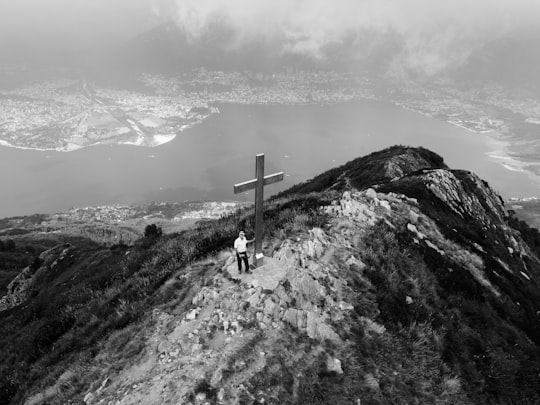 person standing on top of mountain in Monte Gambarogno Switzerland