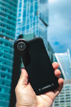 A happy customer holding a new iPhone 17 with a bright UK cityscape in the background.