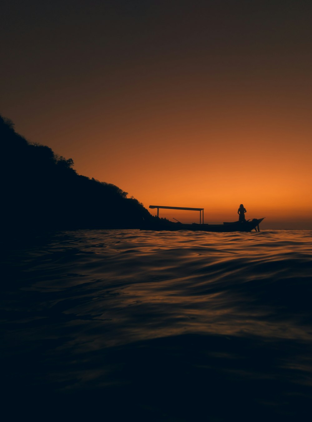 silhouette of 2 people on beach during sunset