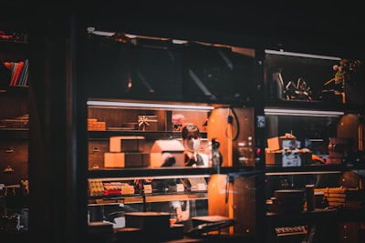 Photo of a friendly person packing a product with care in a cozy home office.