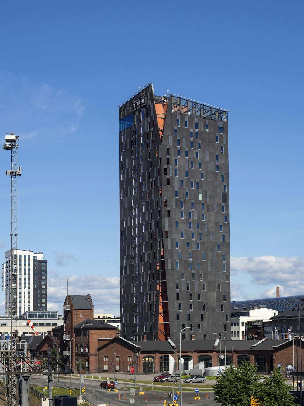 black and brown high rise building under blue sky during daytime