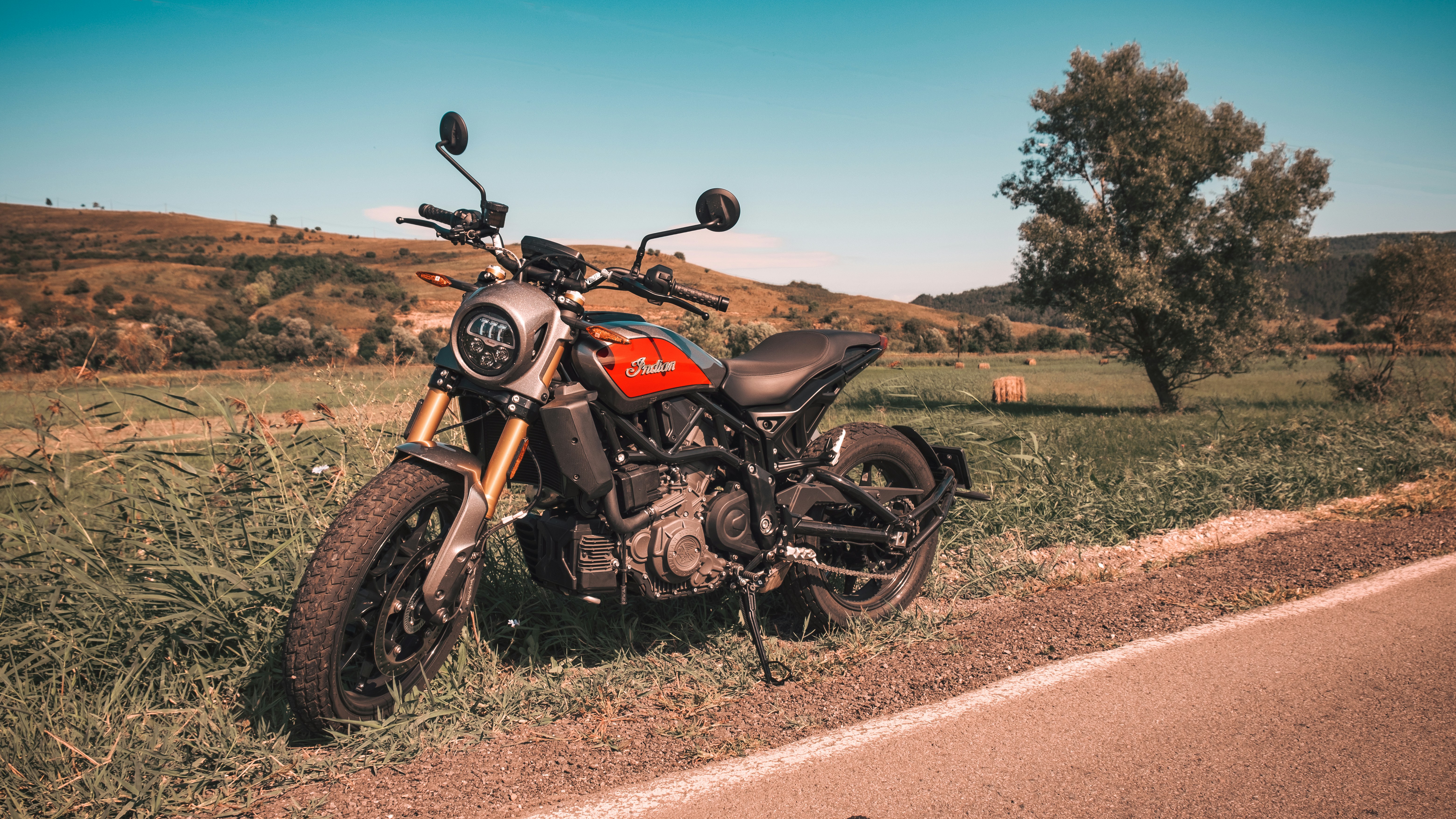 black and gray cruiser motorcycle on brown dirt road during daytime