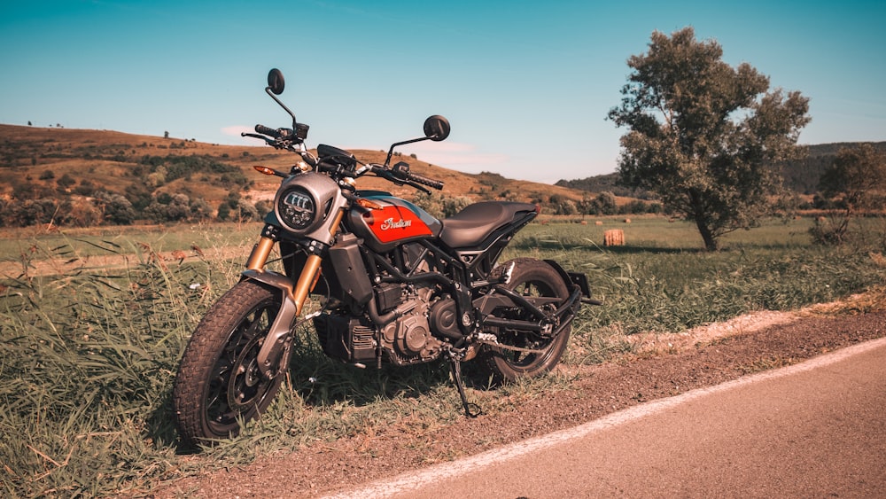 black and gray cruiser motorcycle on brown dirt road during daytime