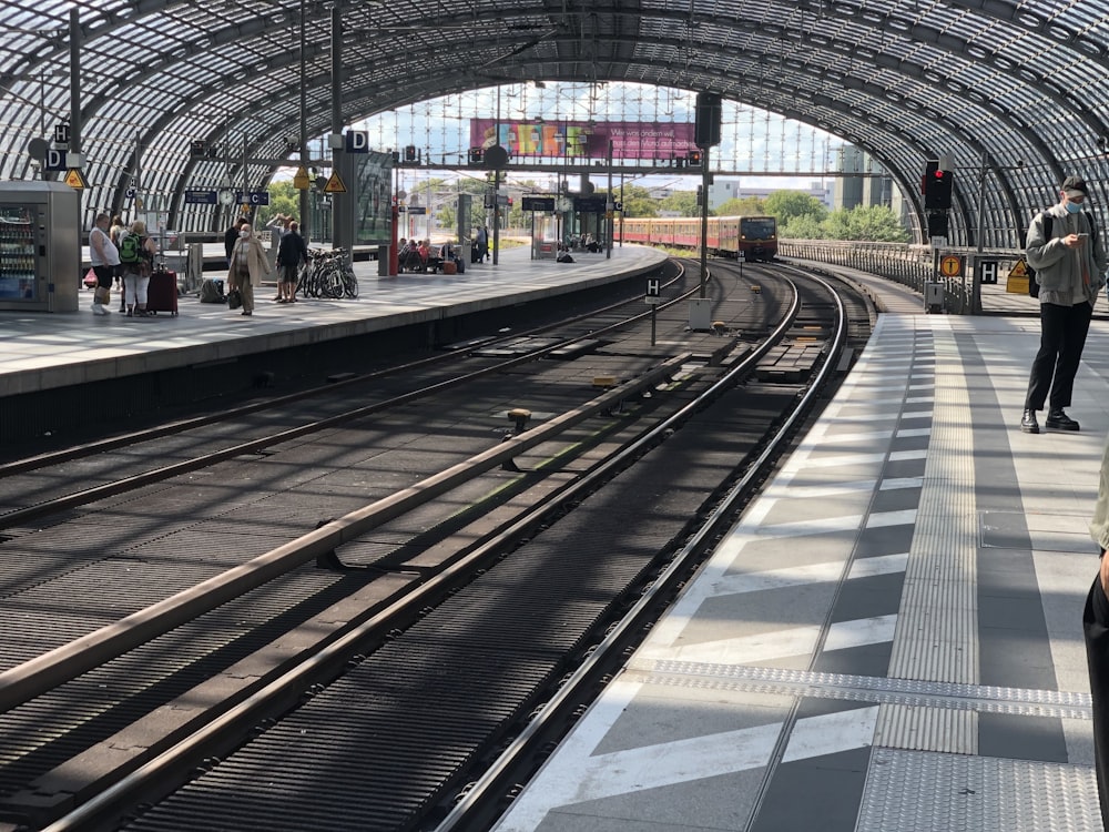 people walking on train station during daytime