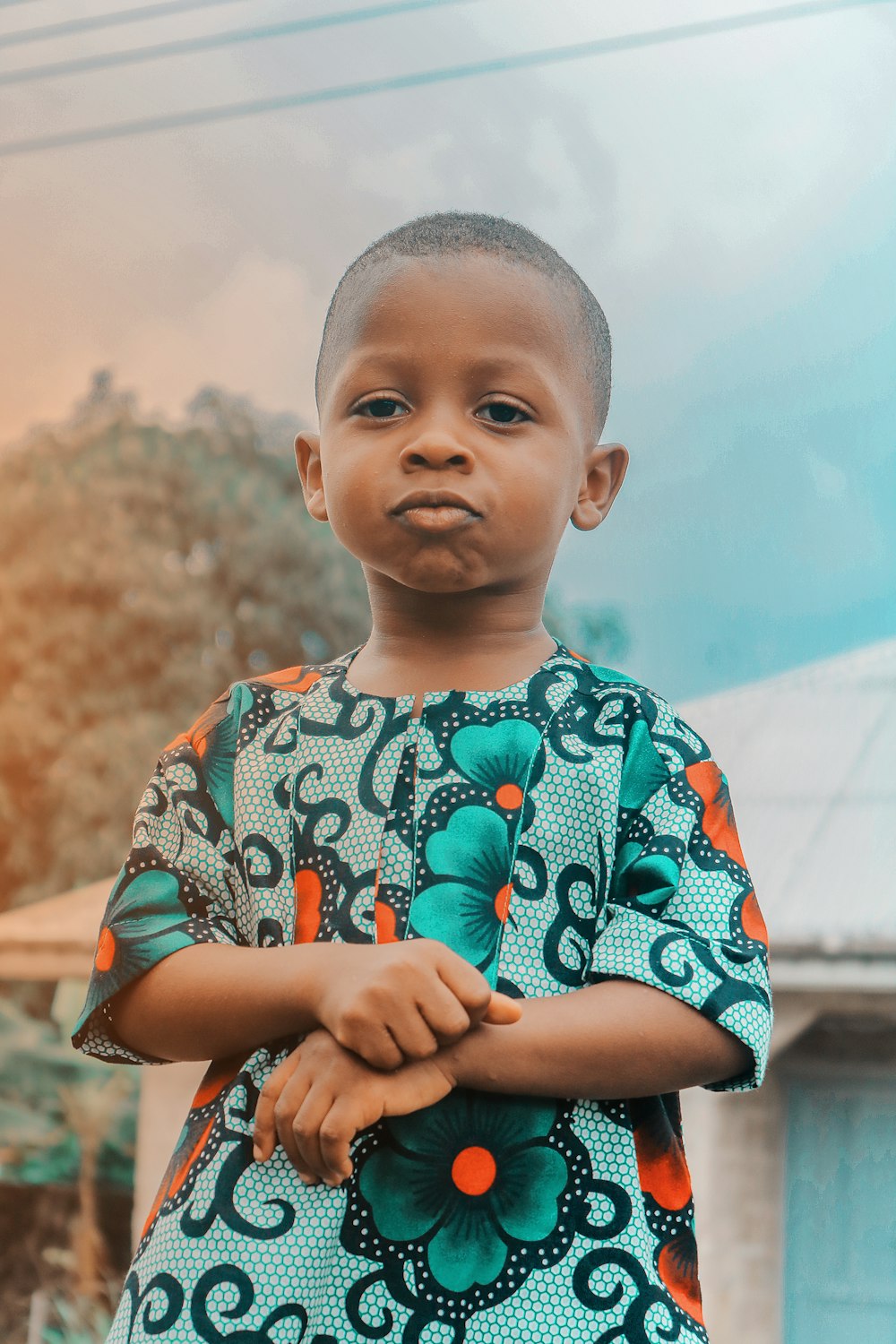 boy in blue and white crew neck t-shirt