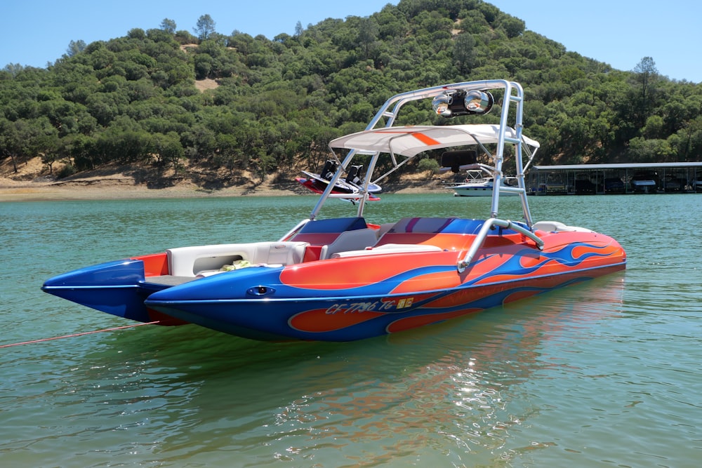 white and blue boat on water during daytime