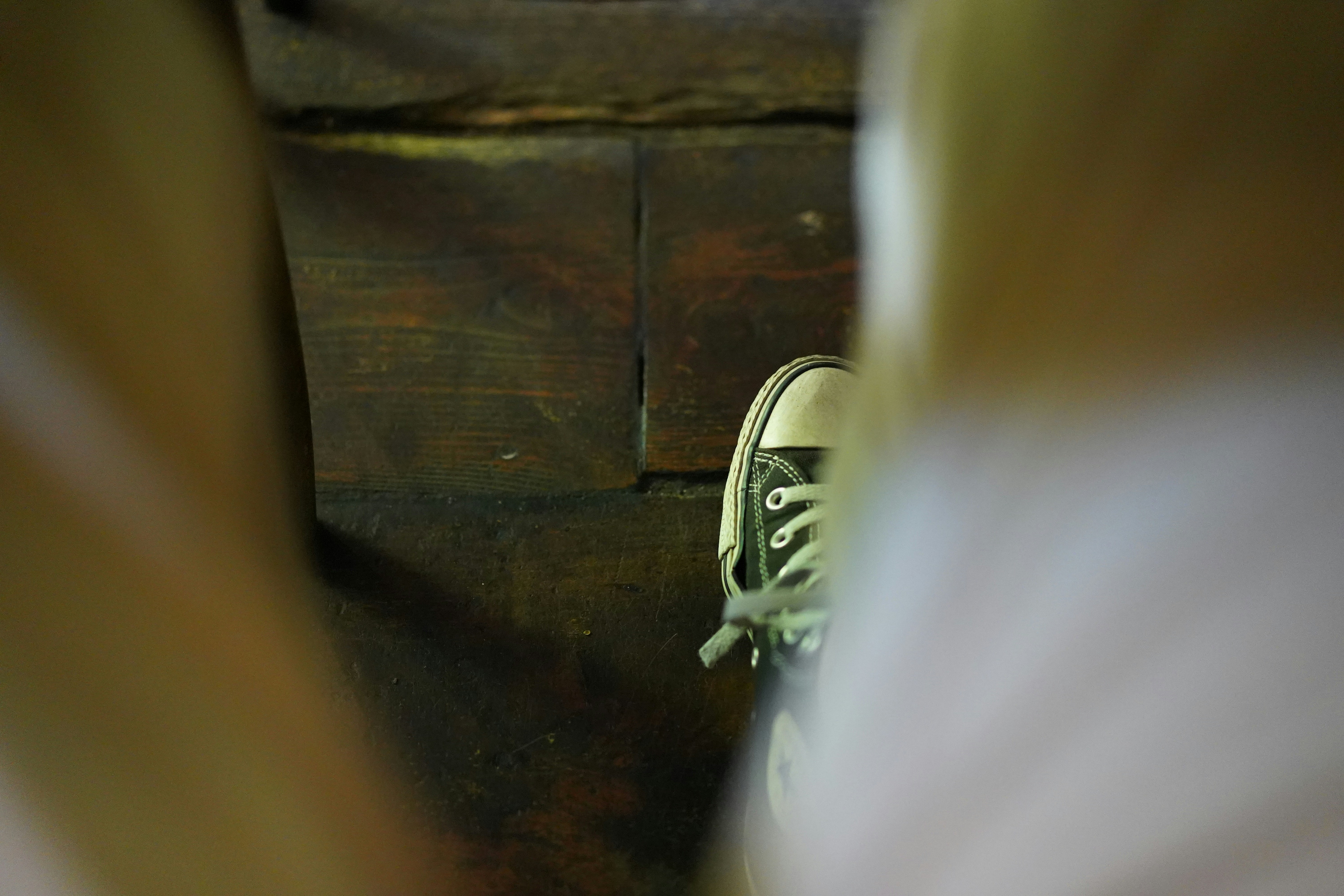 person wearing black and white sneakers