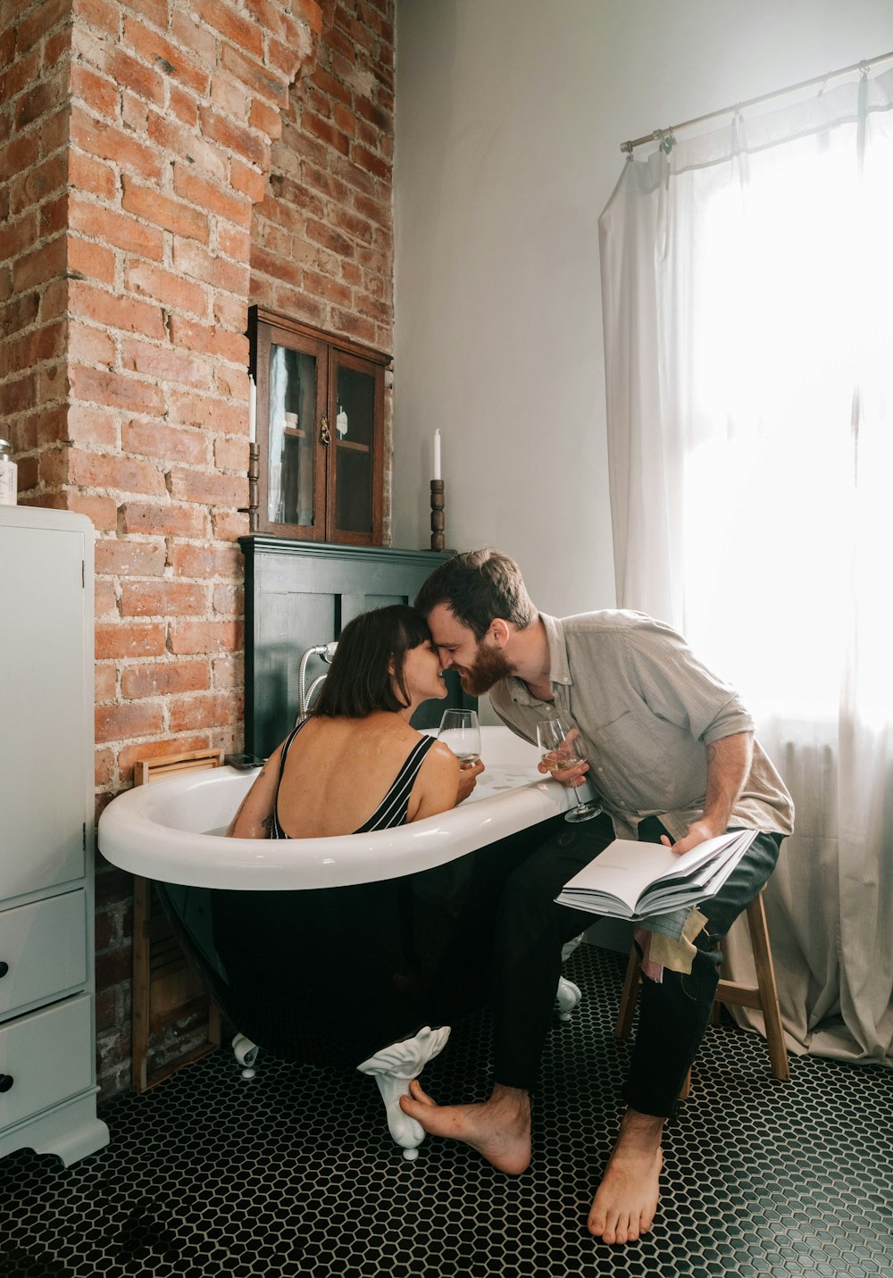 Man And Woman Sitting On Bathtub Reading Book Photo Free Human Image On Unsplash Man And Woman Sitting On Bathtub Reading Book Photo Free Human Image On Unsplash