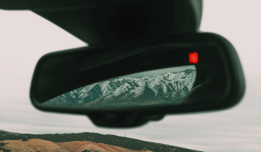 car side mirror with water droplets