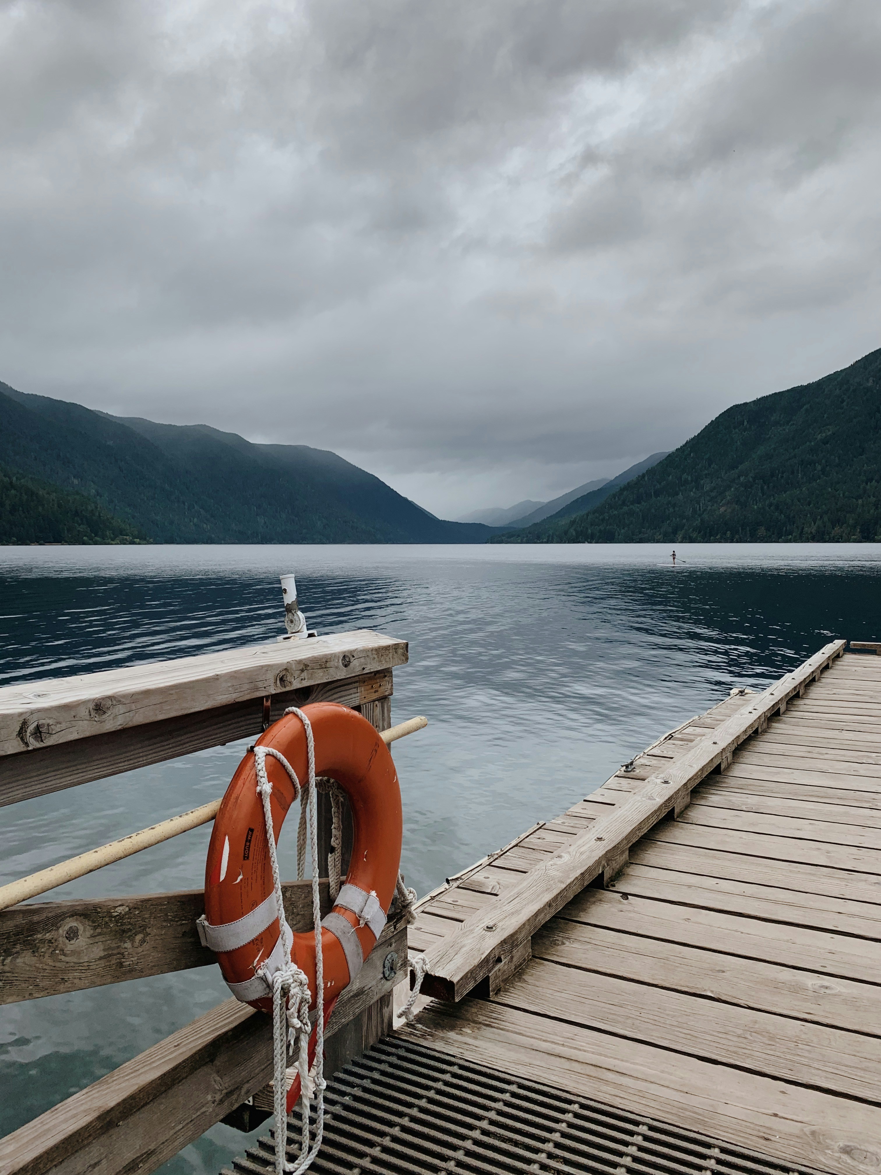 brown wooden dock on lake during daytime