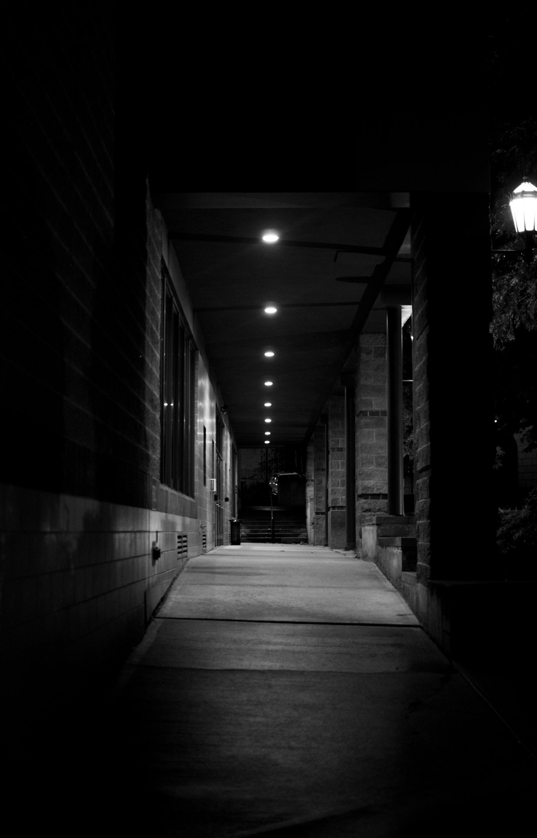 grayscale photo of empty hallway