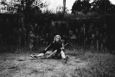 A calm and hopeful person sitting outdoors, symbolizing recovery from addiction.