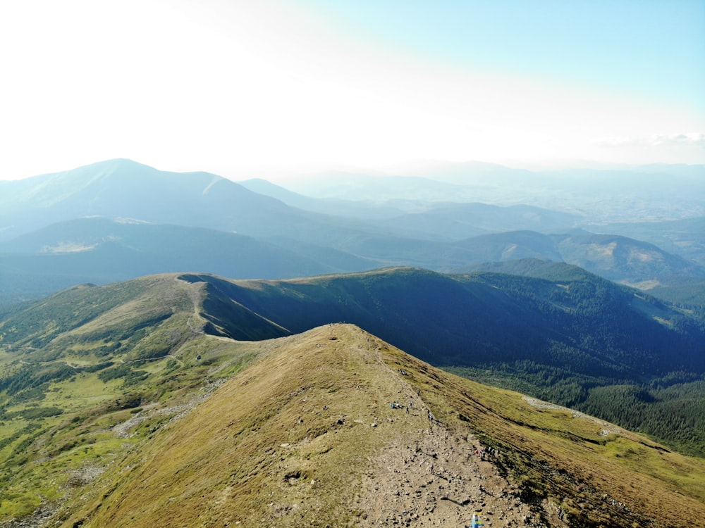 green and brown mountain under white sky during daytime