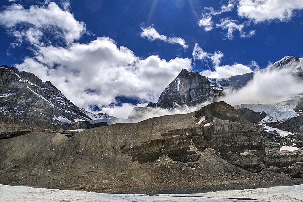 brown and white mountain under blue sky during daytime