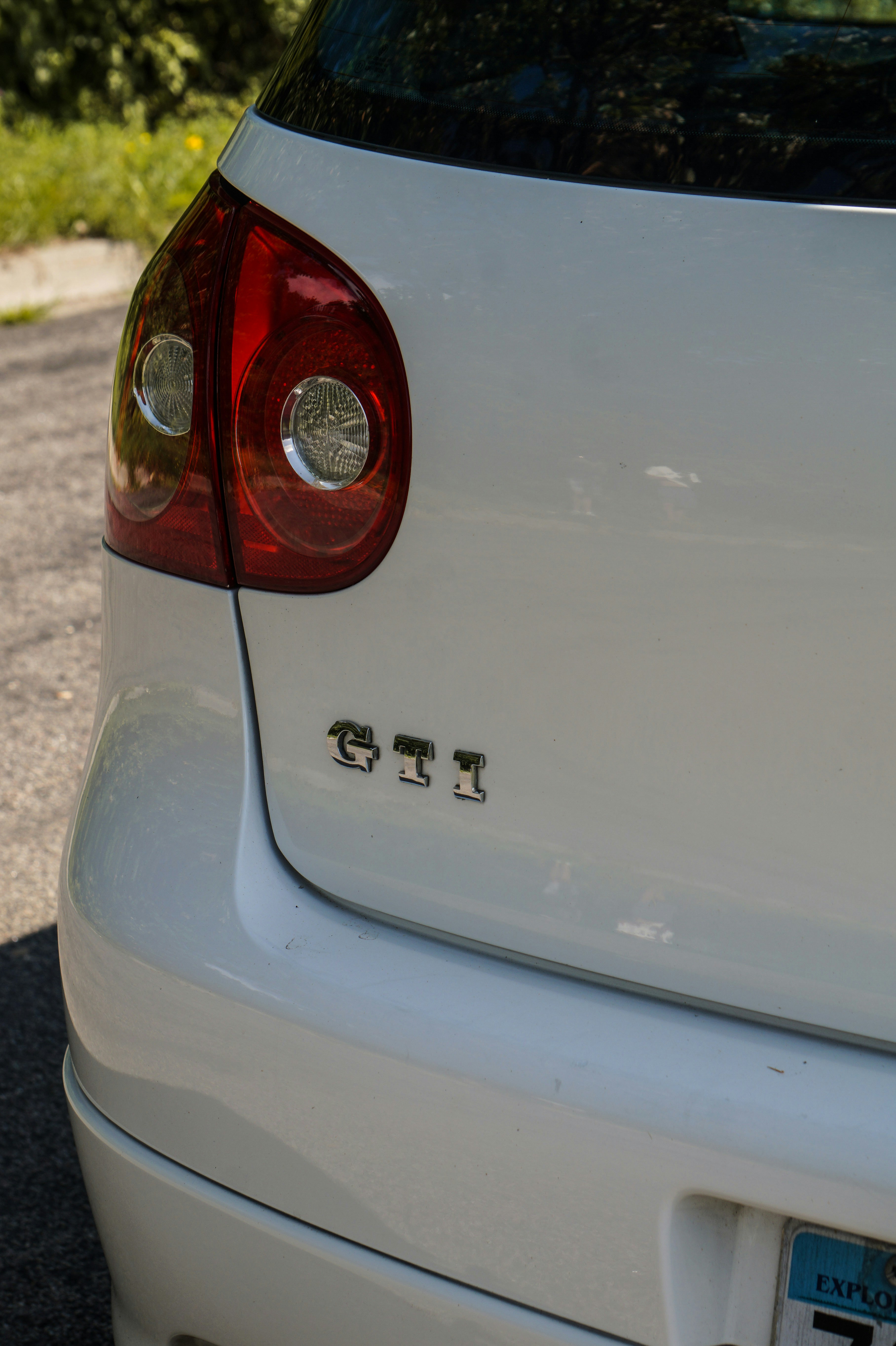 white car with red and black door