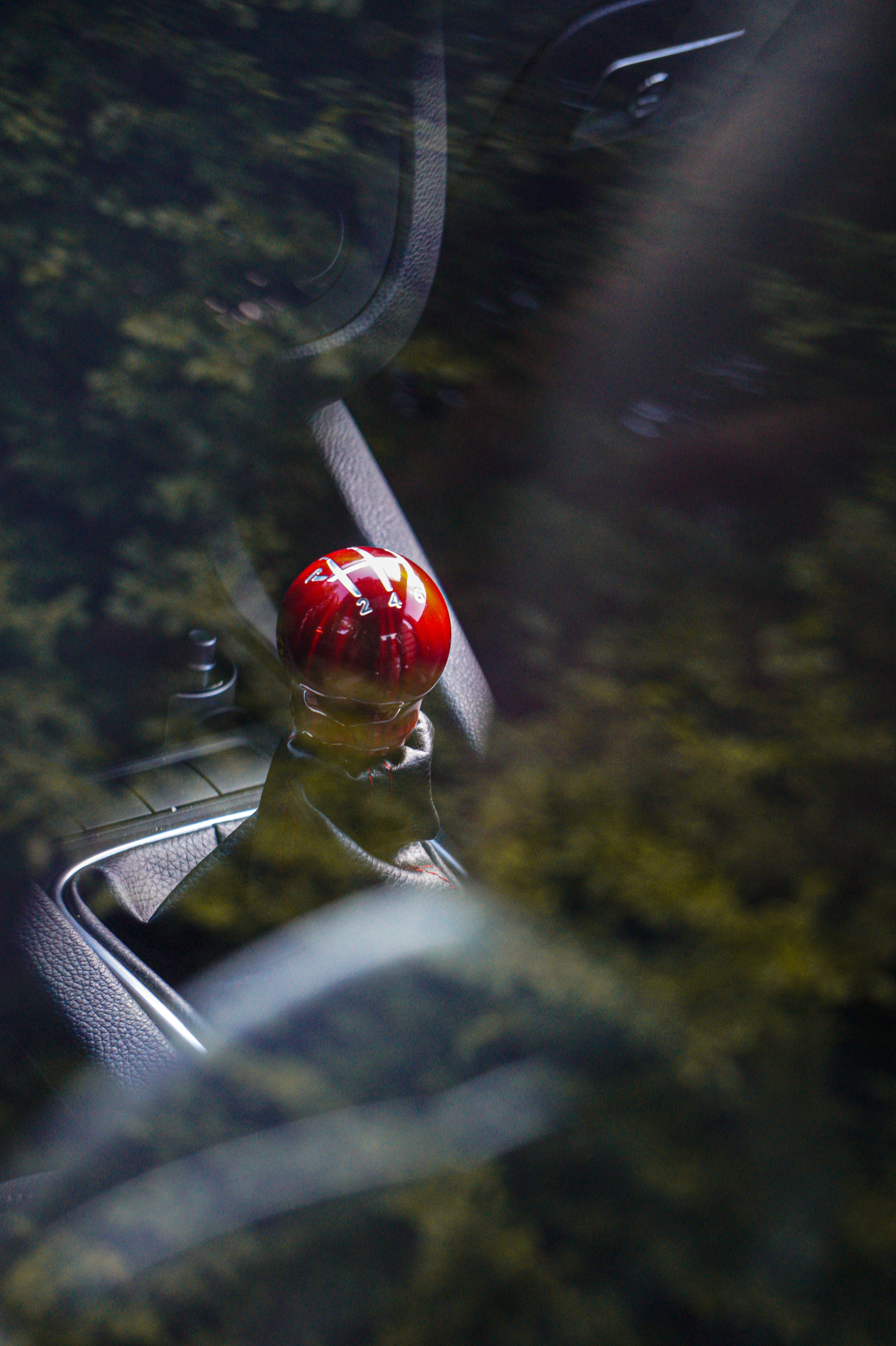 red and white santa hat on car hood