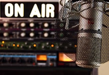 a microphone in front of a sound board