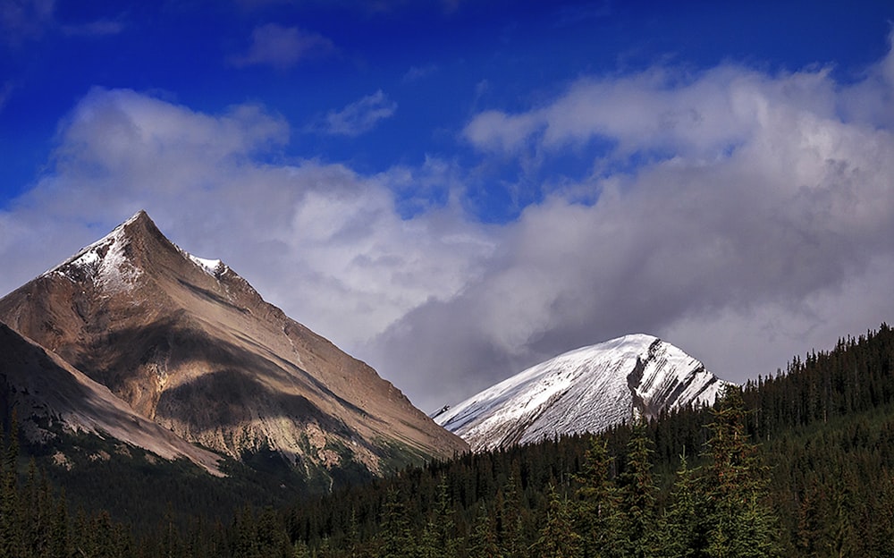 snow covered mountain under blue sky during daytime