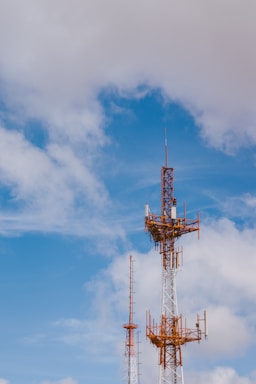 red and black tower under blue sky