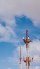 red and black tower under blue sky