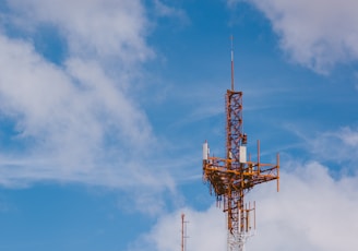 red and black tower under blue sky