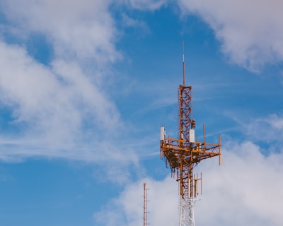 red and black tower under blue sky