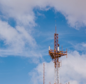 red and black tower under blue sky