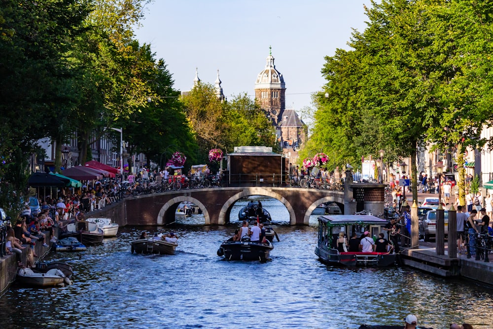 people riding on boat on river during daytime