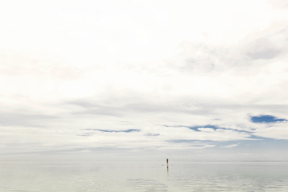 body of water under cloudy sky during daytime