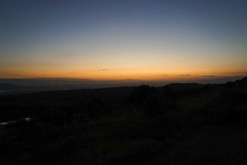 silhouette of mountain during sunset