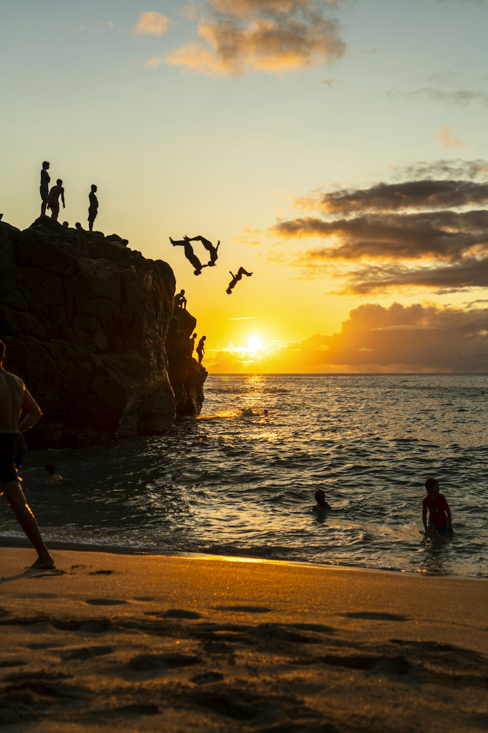 silhouette of people on beach during sunset