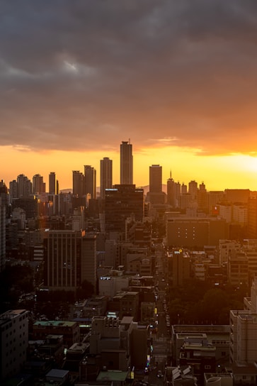 city skyline during orange sunset