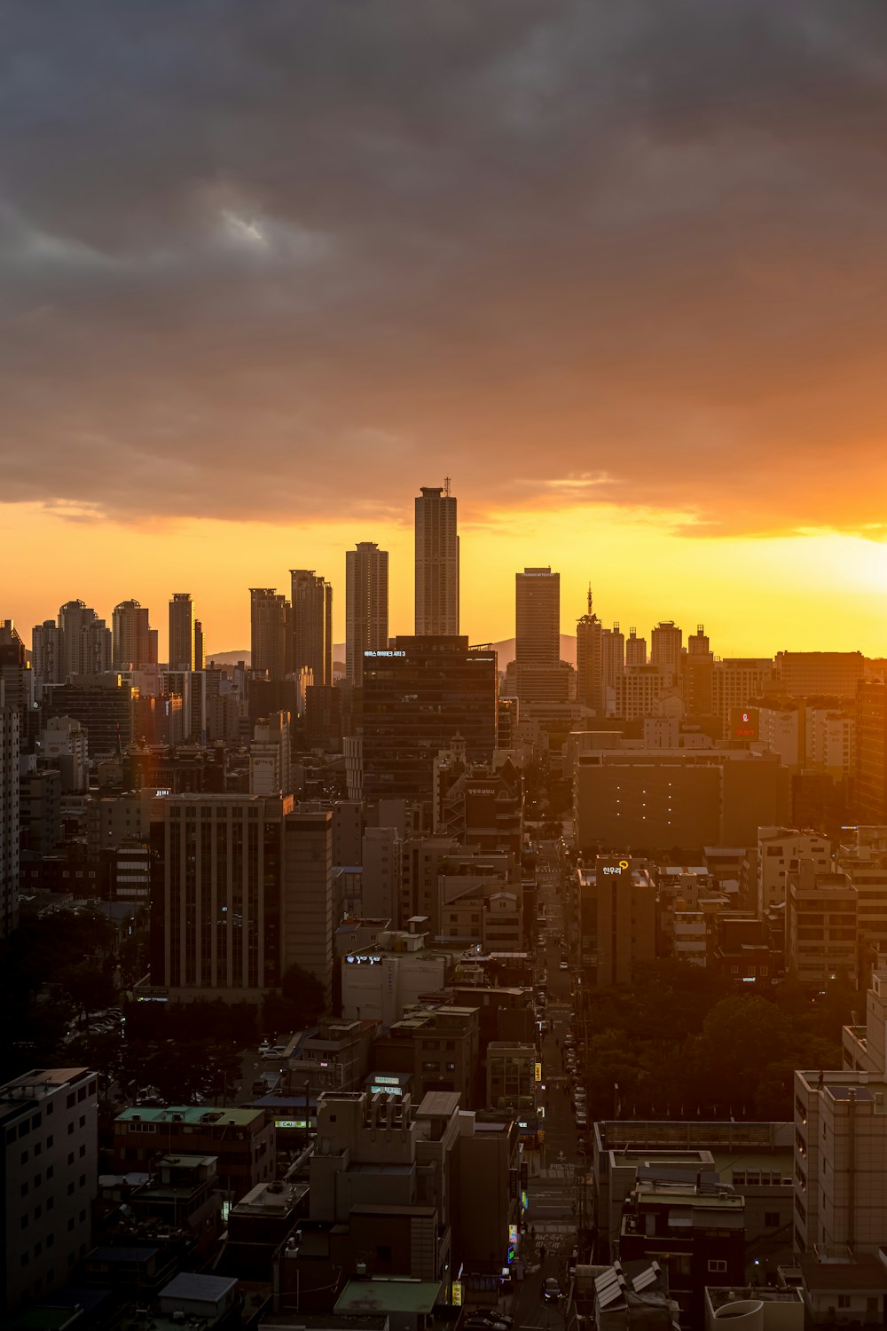 city skyline during orange sunset