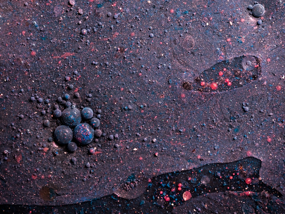 black stones on gray sand