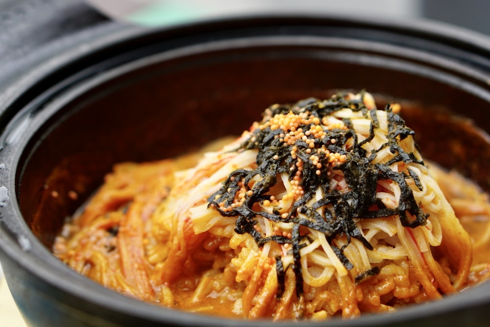 pasta dish in black ceramic bowl