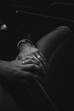 grayscale photo of person wearing watch