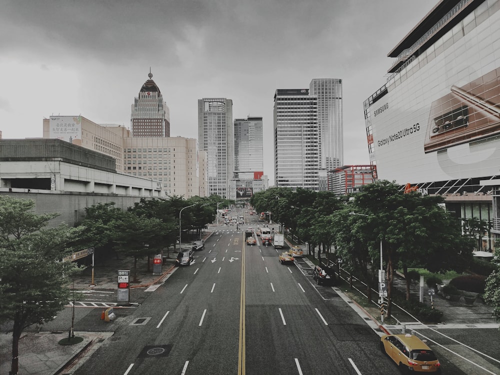 cars on road near buildings during daytime