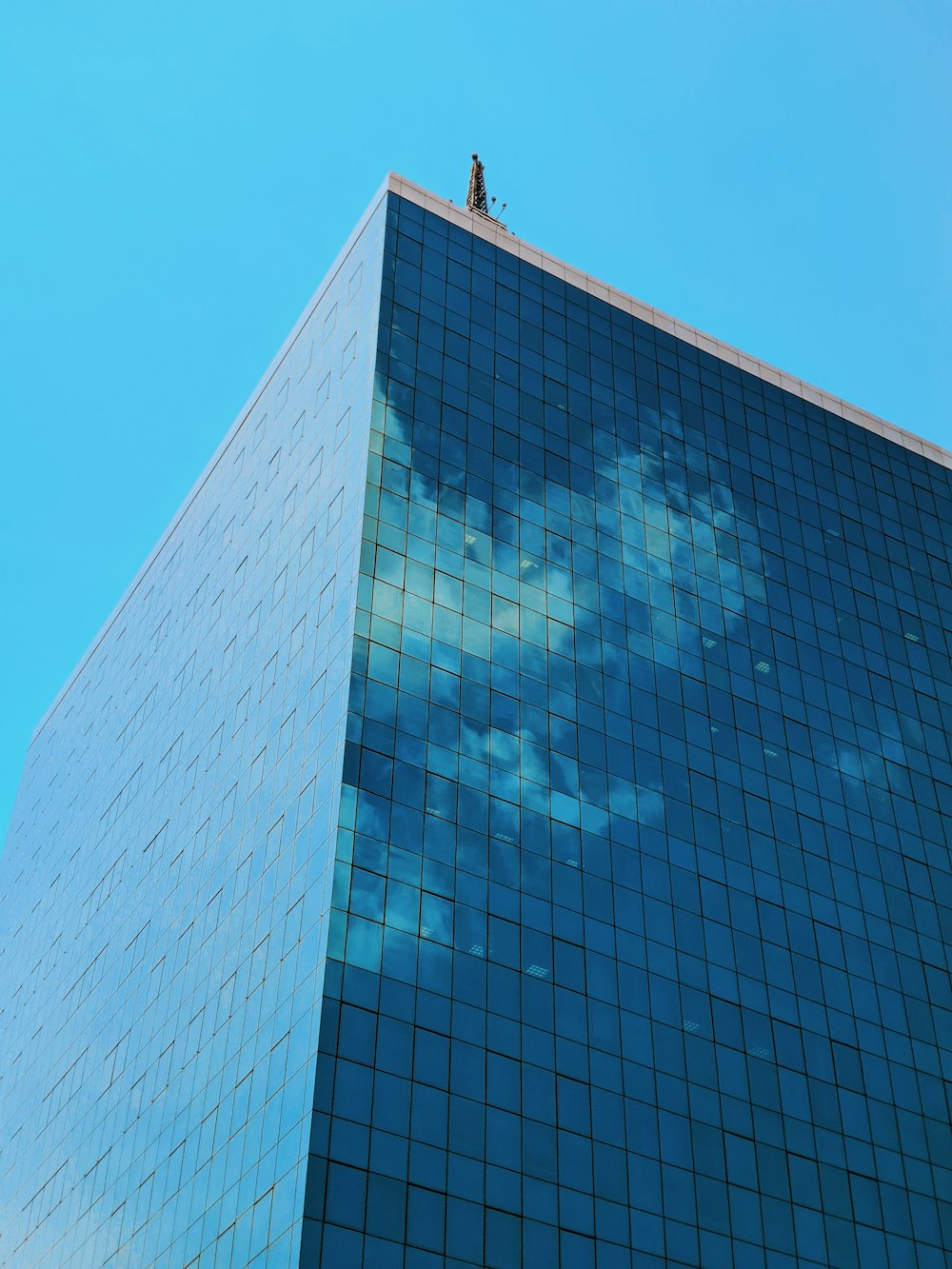 blue and white concrete building under blue sky during daytime
