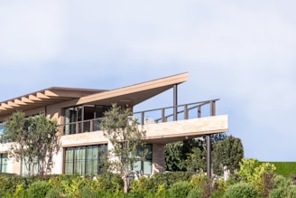 brown wooden bench near green plants during daytime