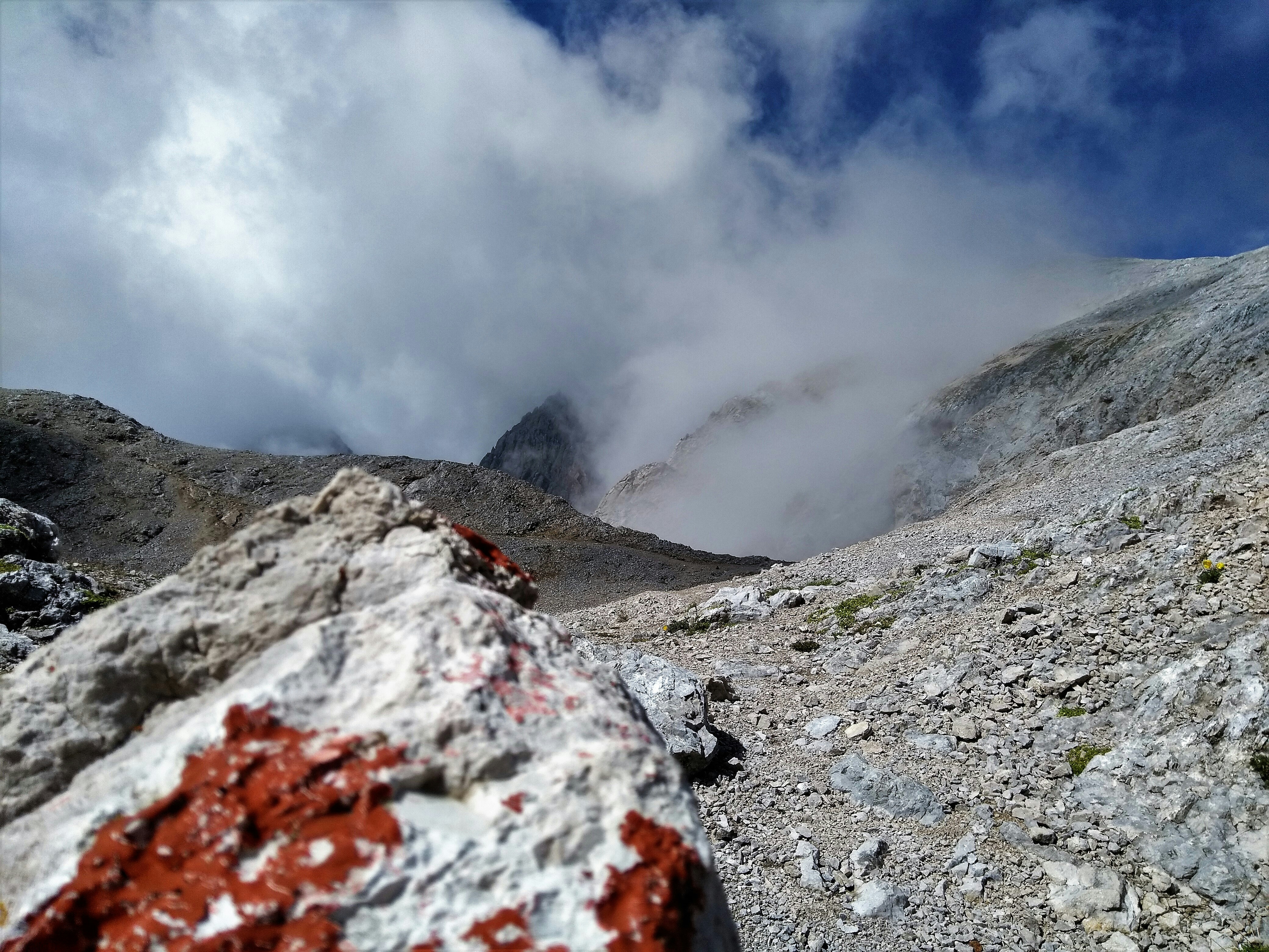 white clouds over rocky mountain, 