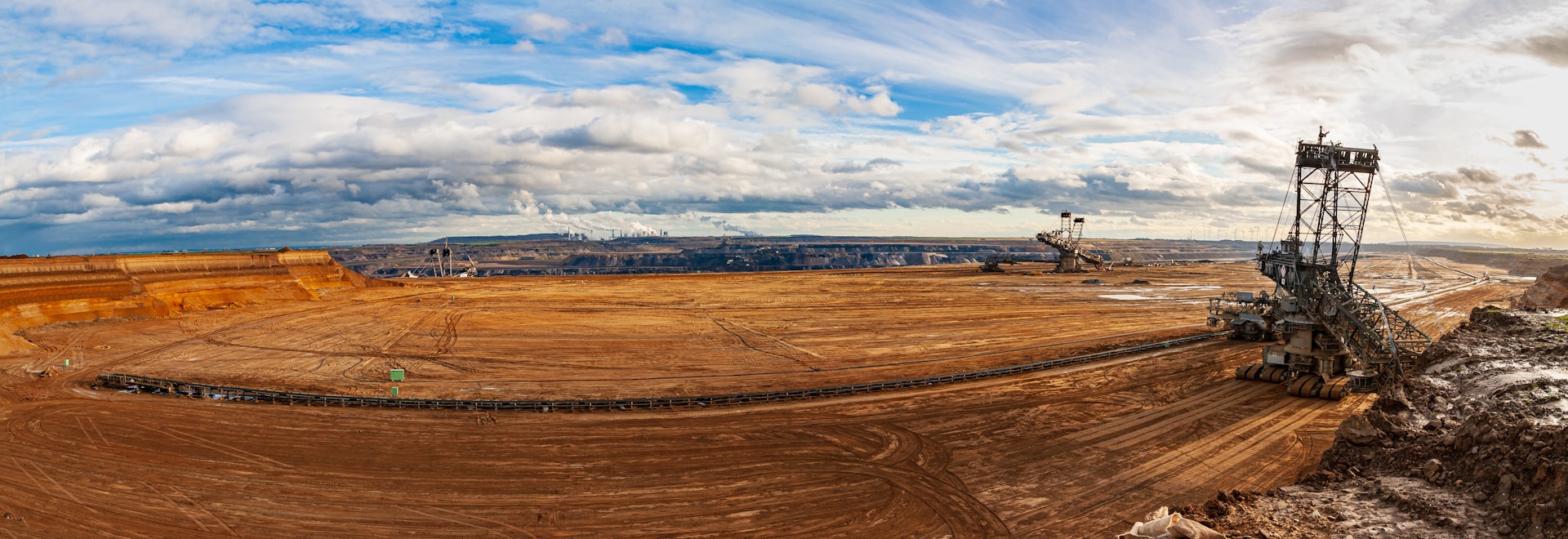 brown field under blue sky during daytime