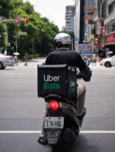 man in black jacket riding motorcycle on road during daytime