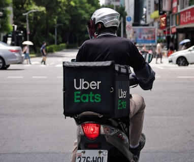 man in black jacket riding motorcycle on road during daytime