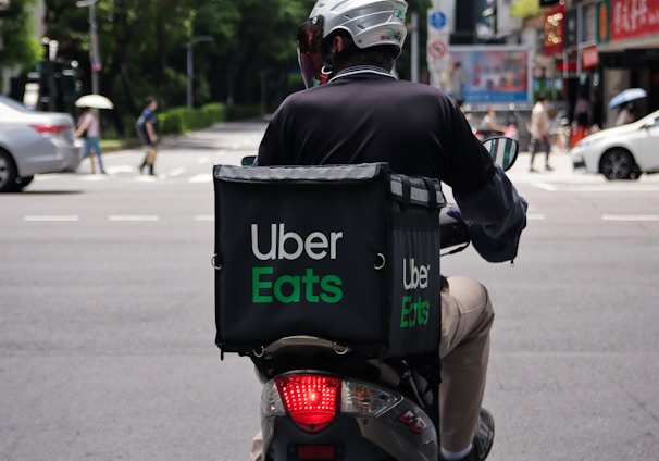 man in black jacket riding motorcycle on road during daytime