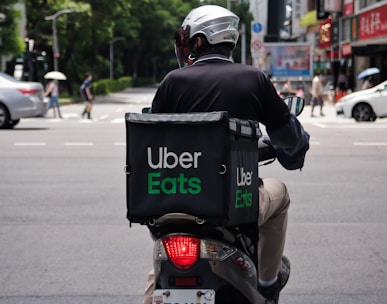 man in black jacket riding motorcycle on road during daytime