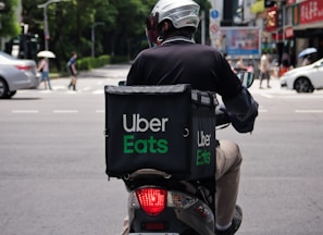 man in black jacket riding motorcycle on road during daytime