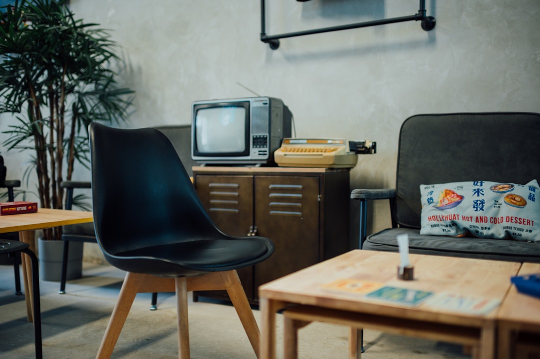 black crt tv on brown wooden table